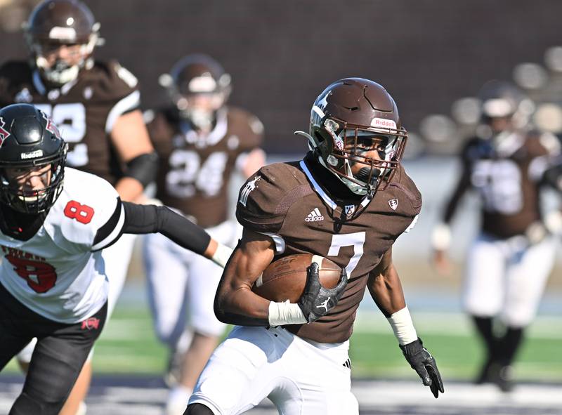 Joliet Catholic Academy's running back Hiram J. Grigsby III (7) runs the ball during the class 5A second round playoff game against Triad on Saturday, Nov. 04, 2023, at Joliet. (Dean Reid for Shaw Local News Network)