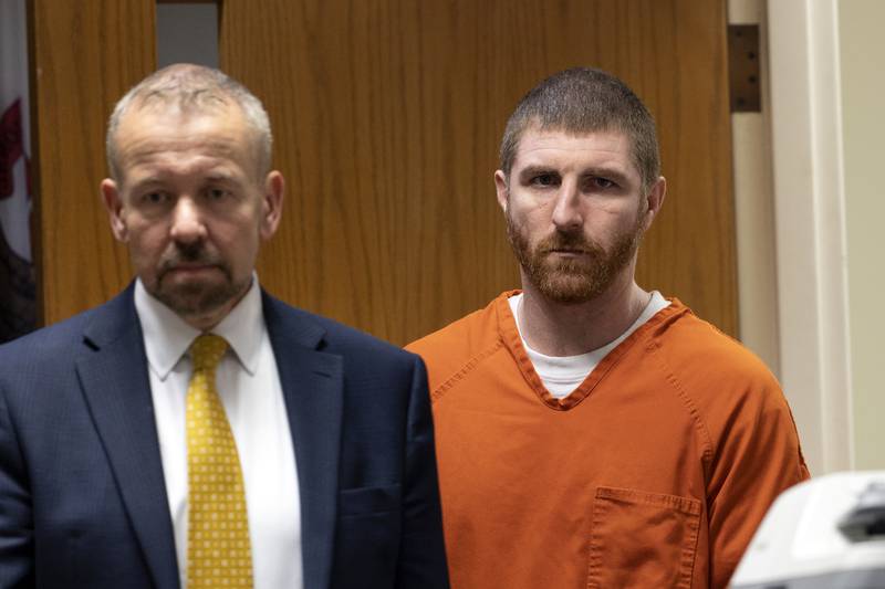 Kyle Cooper (right) follows defense attorney Jim Mertes into court Thursday, May 22, 2025, at the Whiteside County Courthouse in Morrison. Cooper struck a plea deal in which he pleaded guilty to second-degree murder in connection with the Feb. 14 stabbing death of Daniel J. Gordon.