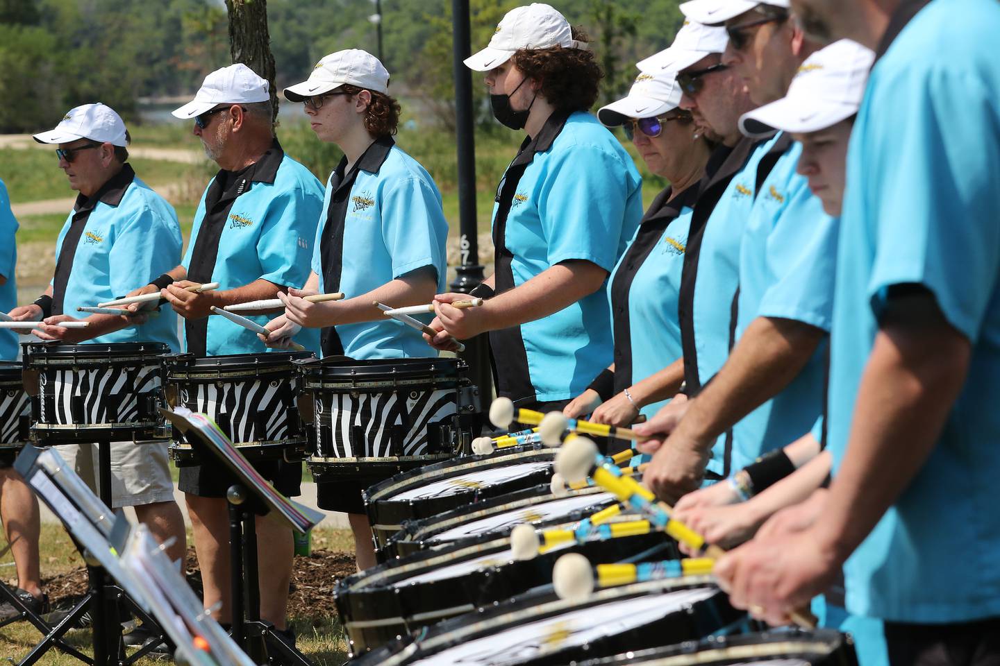 The Crystal Lake Strikers Drumline performs during a celebration of life honoring former Crystal Lake Mayor Aaron Shepley on Saturday, June 12, 2021 at Three Oaks Recreation Area  in Crystal Lake.