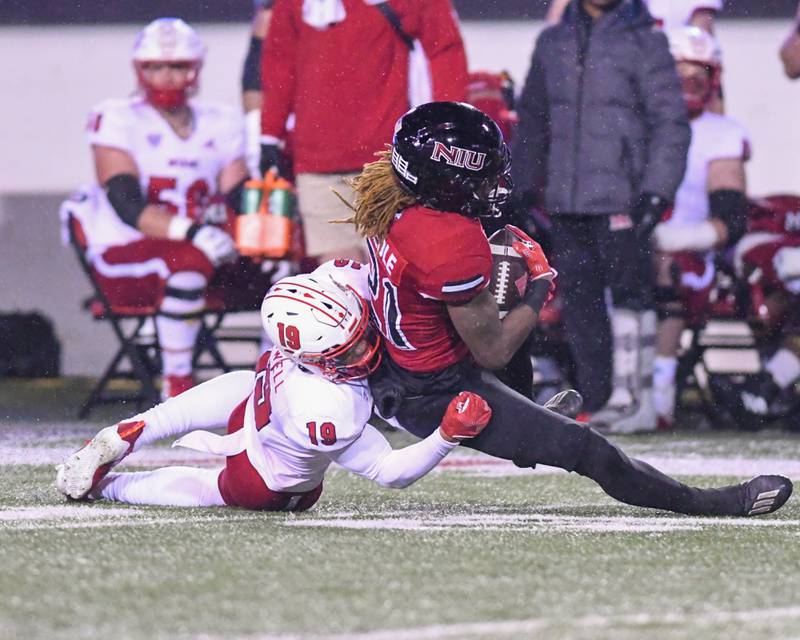 NIU running back Jaiden credle gets brought down by a Miami Of Ohio defender after getting a first down during the first quarter Wednesday Nov. 16th at Huskies Stadium in DeKalb.