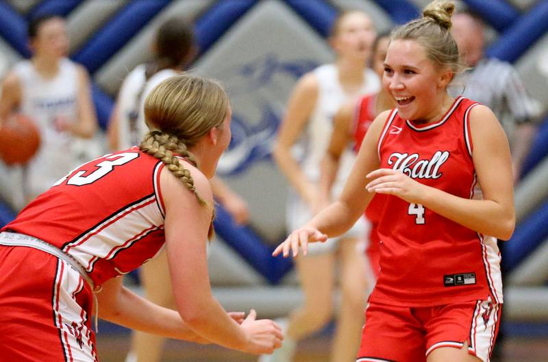 Hall's Charlie Pellegrini reacts with teammate Caroline Morris after sinking a three-point basket against Princeton during the Princeton Holiday Girls Basketball Tournament on Friday, Nov. 23, 2024 at Princeton High School.