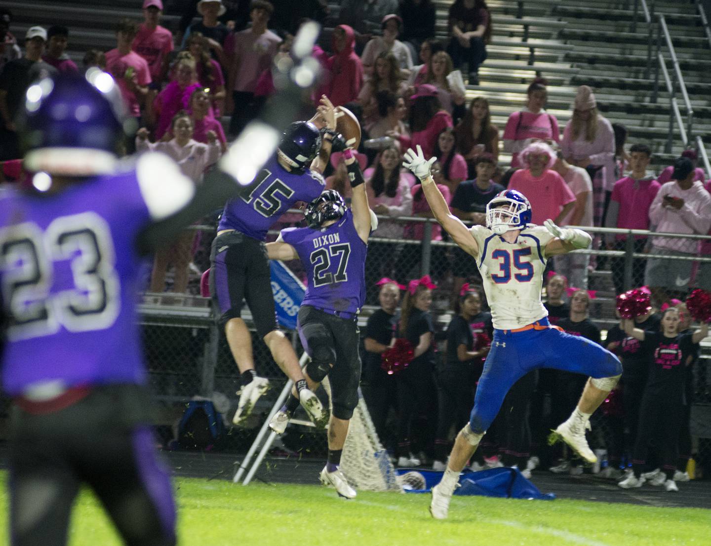 Dixon's Jacob Gaither (#15) and Hunter Gehrt break up a pass intended for G-K's Colin Nesler Friday, Oct. 8, 2021.