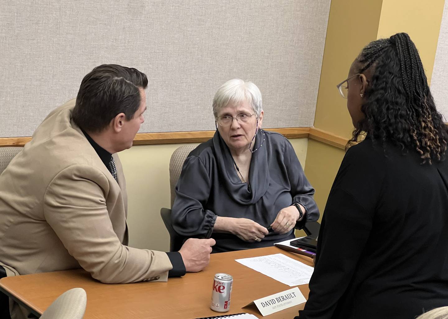 DeKalb County Administrator Brian Gregory, DeKalb County Board Chair Suzanne Willis, a Democrat from District 10, and Rukisha Crawford, a Democrat from District 6, talk after the Sept. 20, 2023 DeKalb County Board meeting.