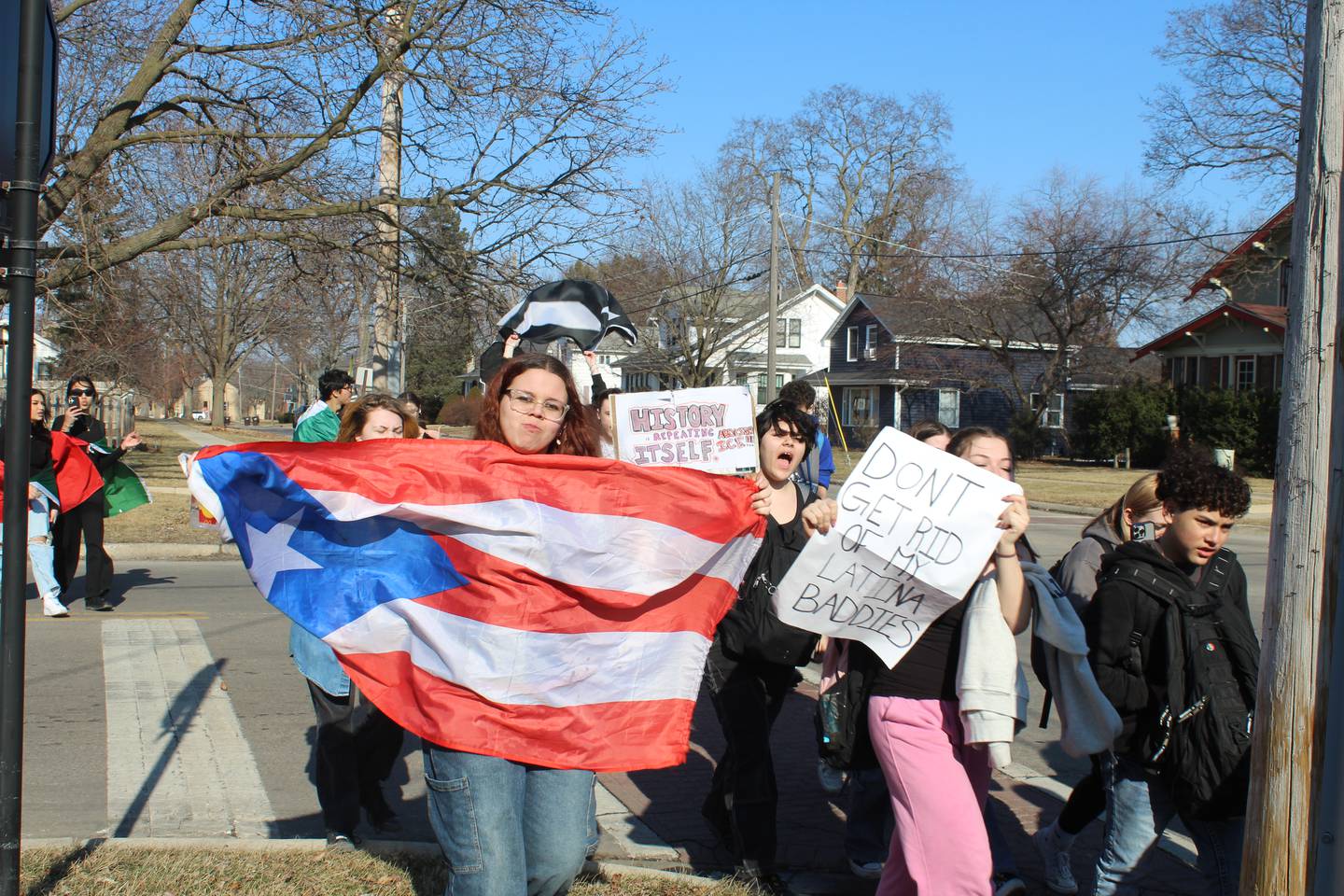 McHenry High School students walk down North Green Street protesting ICE on Feb. 13, 2026.
