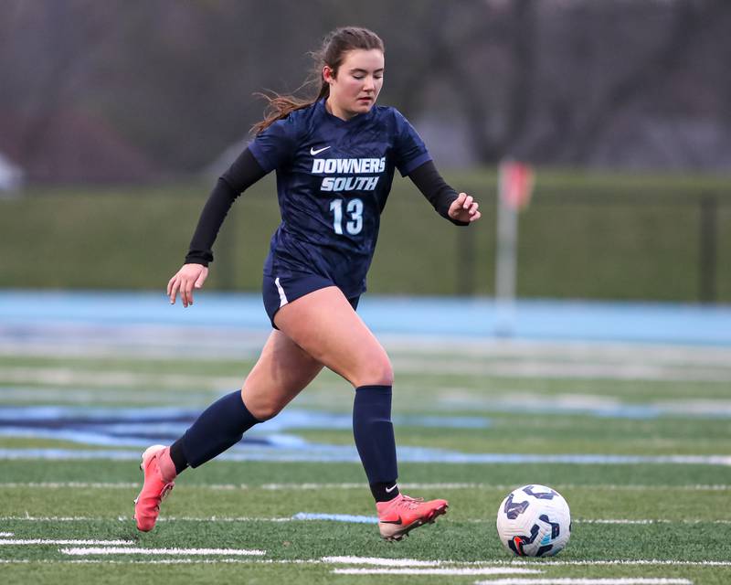 Downers Grove South's Kendall Kuntz (13) races with the ball during soccer match between Riverside-Brookfield at Downers Grove South.  April 10, 2025.