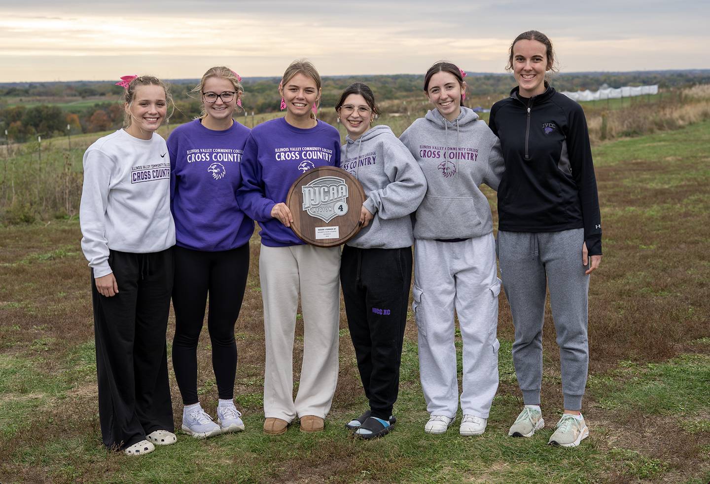 Members of the IVCC women's cross country team (from left) Addyson Miller, Claire Durdan, Kailey Goetsch, Tatiana Serna, Meghann Ostler and Sophia Woods pose with their plaque after placing second at the NJCAA Division II Region 4 Meet on Saturday, Oct. 25, 2025 in Geneva.