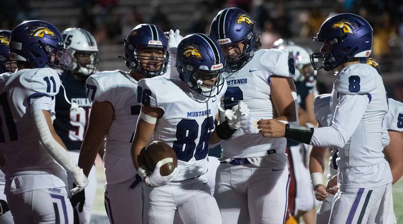 Rolling MeadowsÕ Shea Wells (86) celebrates with his teammates after scoring a first-quarter touchdown against Conant on Friday, Sept. 6, 2024 in Hoffman Estates.