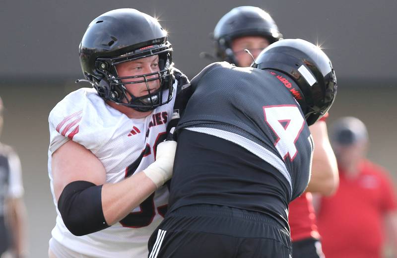 Northern Illinois Huskies offensive lineman Nolan Potter (left) works against defensive end Raishein Thomas during the first practice of the season Wednesday, Aug. 2, 2023, at Huskie Stadium in DeKalb.