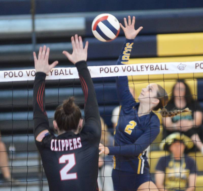 Polo's Laynie Mandrell makes a play at the net as Amboy's Kiera Karlson (2) goes up to block at the Polo Invite on Saturday, Sept. 27, 2025.
