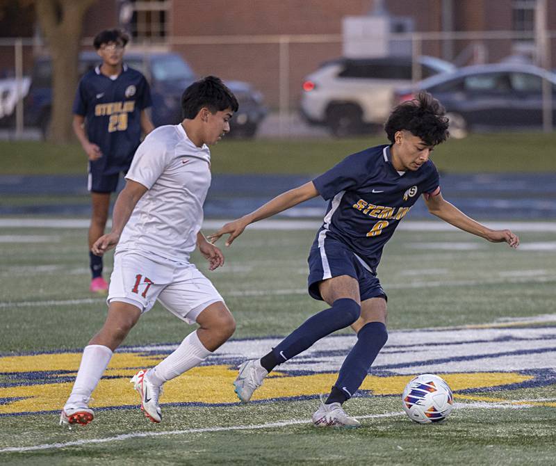 Sterling’s Daniel Bermudez handles the ball in front of Lasalle-Peru’s Ismael Mejia Tuesday, Oct. 17, 2023 in a regional semifinal in Sterling.