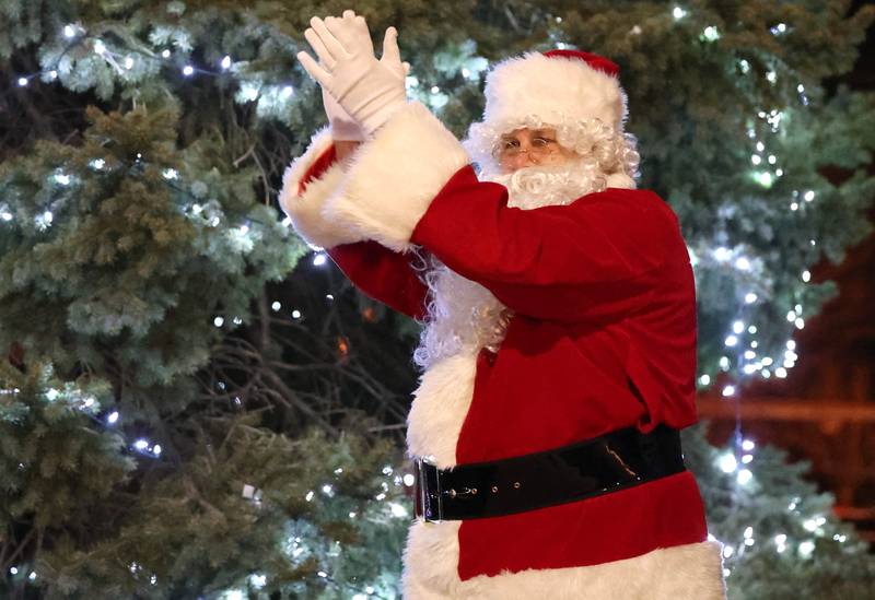 Santa cheers as he lights the tree Friday, Dec. 2, 2022, during Celebrate the Season hosted by the Genoa Area Chamber of Commerce.