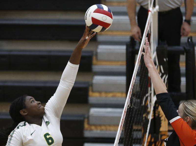 Crystal Lake South's Sahara Okirika tips the ball over the net during a Fox Valley Conference volleyball match McHenry on Thursday, Aug. 28, 2025, at the Freshman Campus of McHenry High School in McHenry.