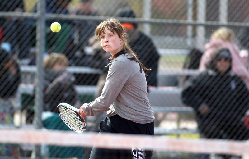 Prairie Ridge’s Madeleine Bartmess goes after the ball in a match with doubles partner Kelsey Collins (not pictured) during the first day of the IHSA state tennis tournament at Palatine High School on Thursday, Oct. 20, 2022.