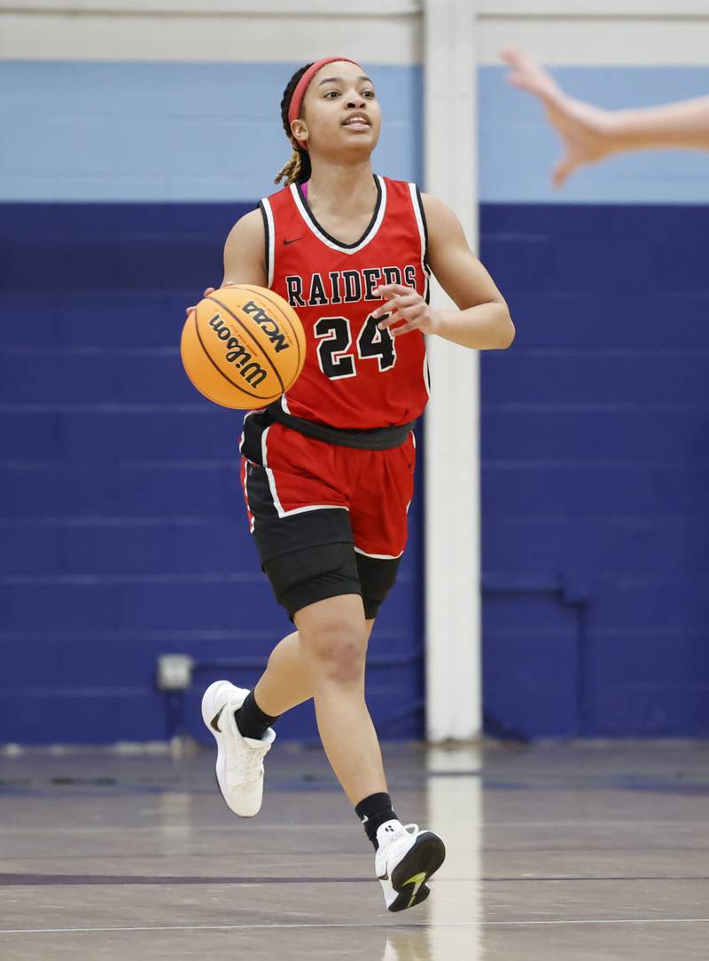 Bolingbrook's A'mya Simmons (24) handles the ball during the varsity basketball game between Bolingbrook high school and Nazareth Academy on Monday, Jan. 12, 2026 in La Grange Park.