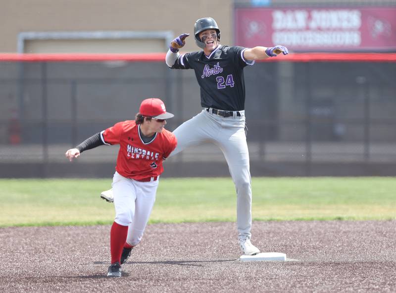 Downers Grove North's George Wolkow (24) celebrates a double during the IHSA Class 4A baseball regional final between Downers Grove North and Hinsdale Central at Bolingbrook High School on Saturday, May 27, 2023.