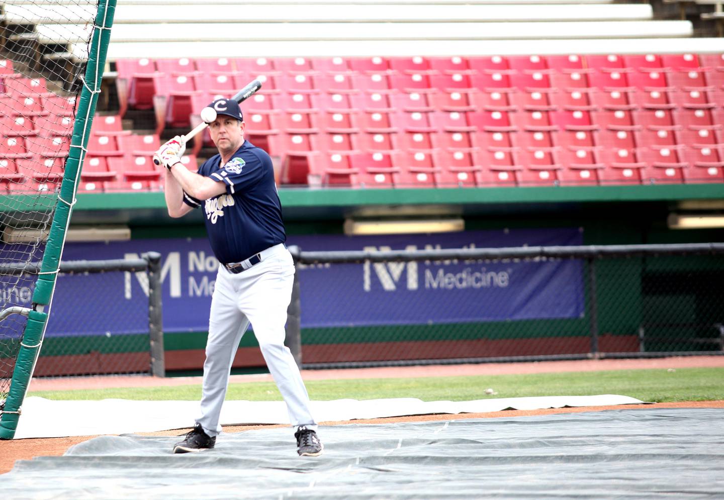 Kane County Cougars Manager George Tsamis runs batting practice with his team at Northwestern Medicine Field in Geneva in preparation for the 2021 Kane County Cougars baseball season.