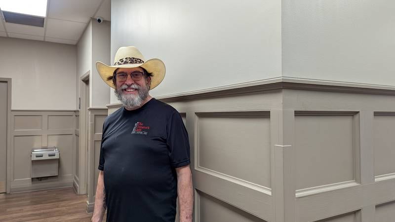 Tom Grotovsky, owner of The Curator’s Café inside the inside the American Legion Post 1080 in Joliet, is seen moving between dining room and kitchen on  Bluegrass Burger Bash Day, Wednesday, April 30, 2025.