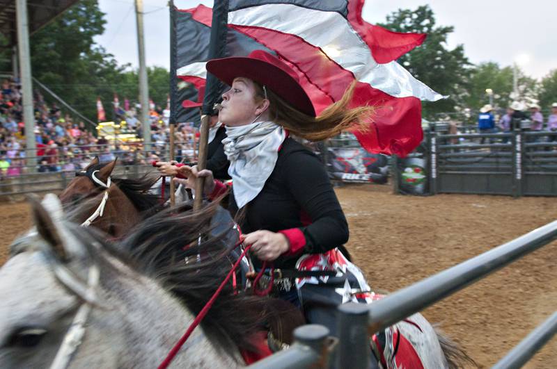 The Stateline Hotshots rodeo drill team perform for the crowd Thursday, August 5, 2021 at the Carroll County Fair in Milledgeville. The riders were part of the Rice Bull Riding rodeo.