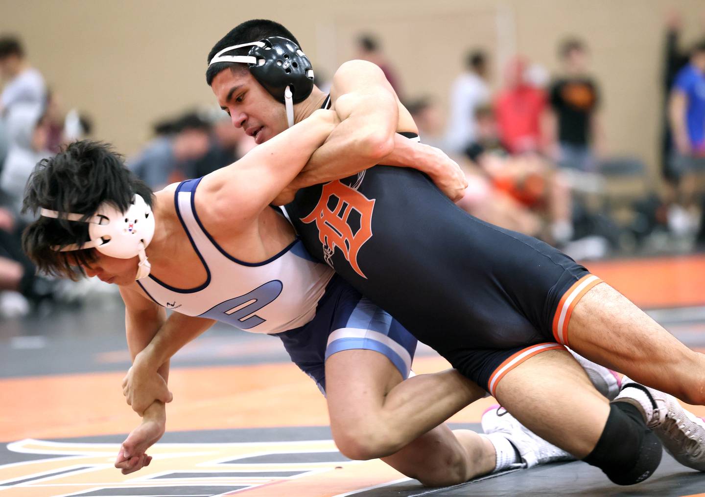DeKalb’s Alan Izaguirre wrestles Prospect’s Ronin Umali in their 126 pound match Friday, Dec. 29, 2023, during the Don Flavin Invitational wrestling tournament at DeKalb High School.