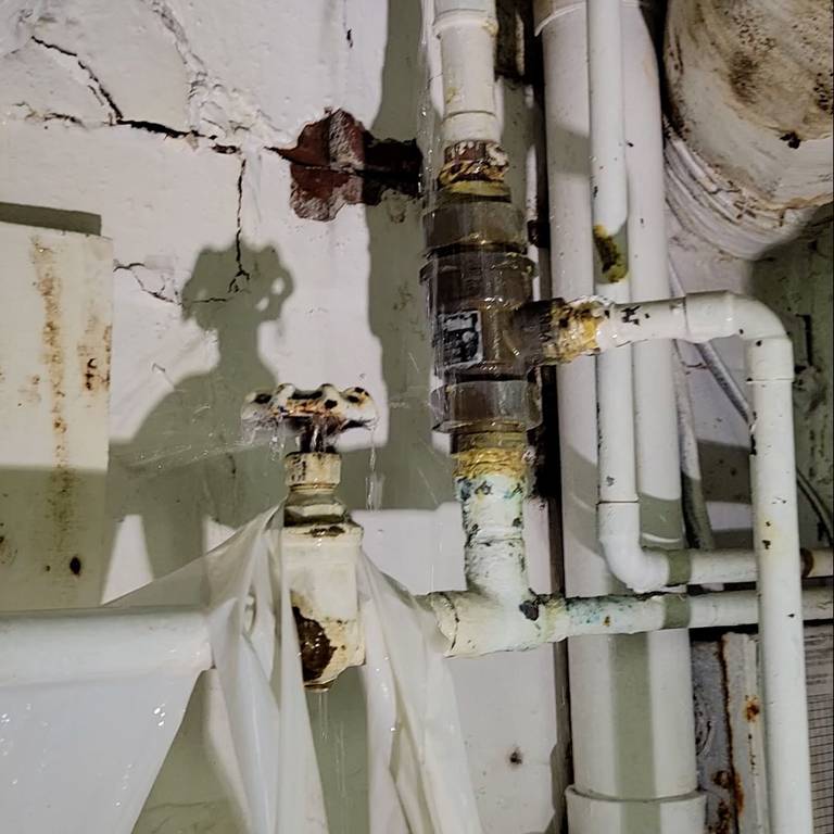 Screenshots from a video show leaky pipes, piles of trash and generally filthy conditions in what a source identified as the embalming room of the Moran Queen-Boggs Funeral Home in Centralia. The source who provided the video requested anonymity due to safety concerns. The funeral home’s director, Hugh Moran, would not confirm its authenticity.