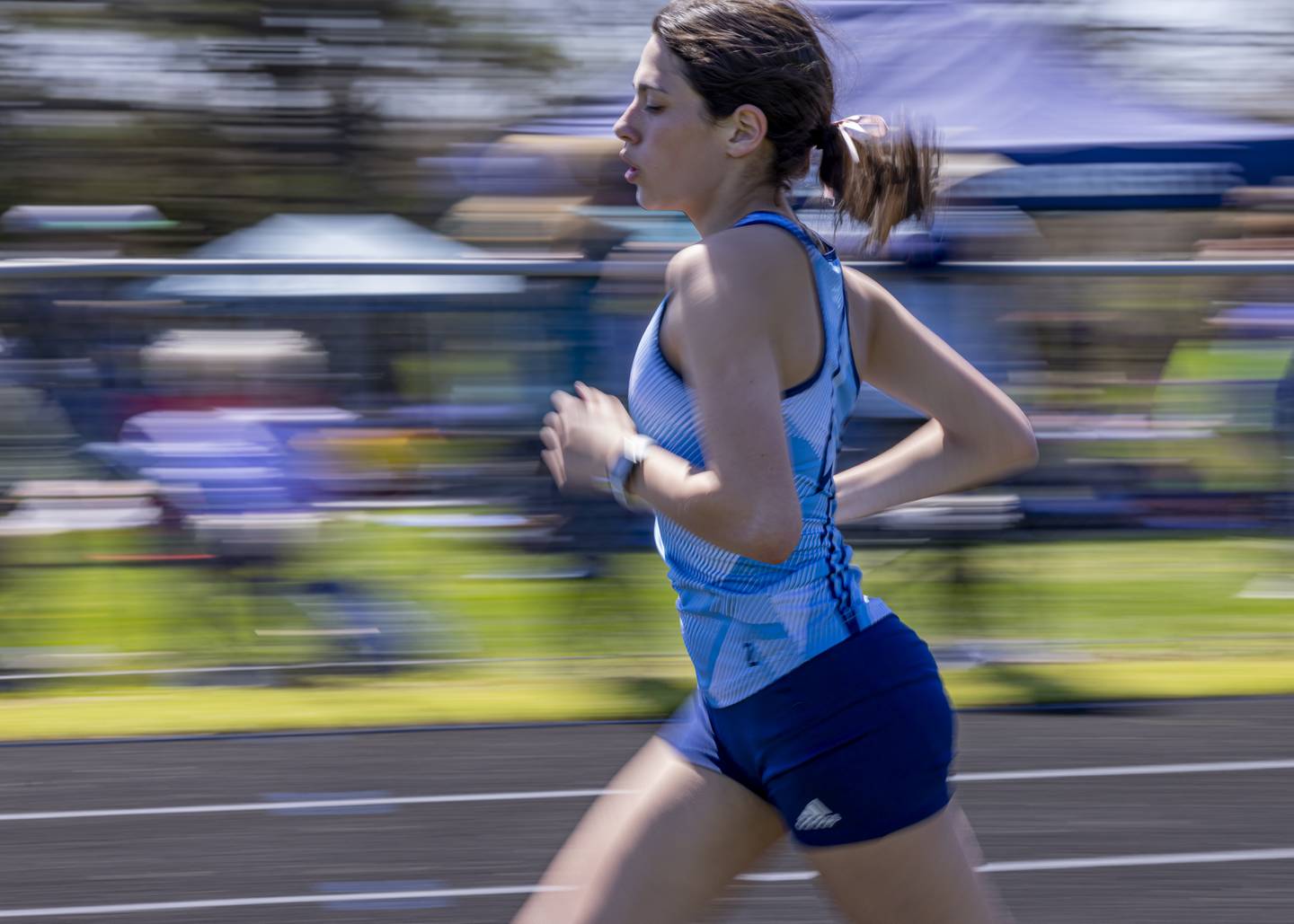 Maddie Witzell of Bureau County competes in the women's 3200 meter race during the Rollie Morris Invite at Hall Highschool on April 13, 2024. Witzell would post a time of 12:50.2 which earned her first place.