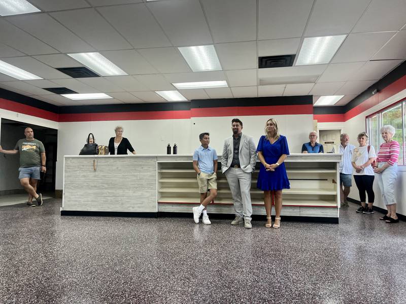 Adim (middle) and Sanela Dzeldini (right) talk about how great the Fulton community has been to work with. The pair is opening an electric vehicle charging station and convenience store called the Steamer Stop.