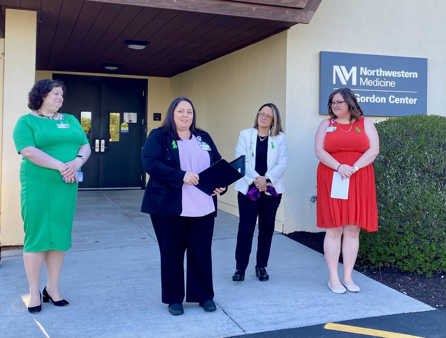 (From left) Cheryl Hahn, co-lead recovery support specialist; Sabrina Nicholson, director (speaking); Yemilei Schroeder, manager; and Laura Szymanski, recovery support specialist at the Northwestern Medicine Ben Gordon Center, 12 Health Services Drive, DeKalb. Center staff held a ribbon cutting ceremony Monday, April 15, 2024, to celebrate the center expanding to offer 24/7 mental health crisis care for those in need.