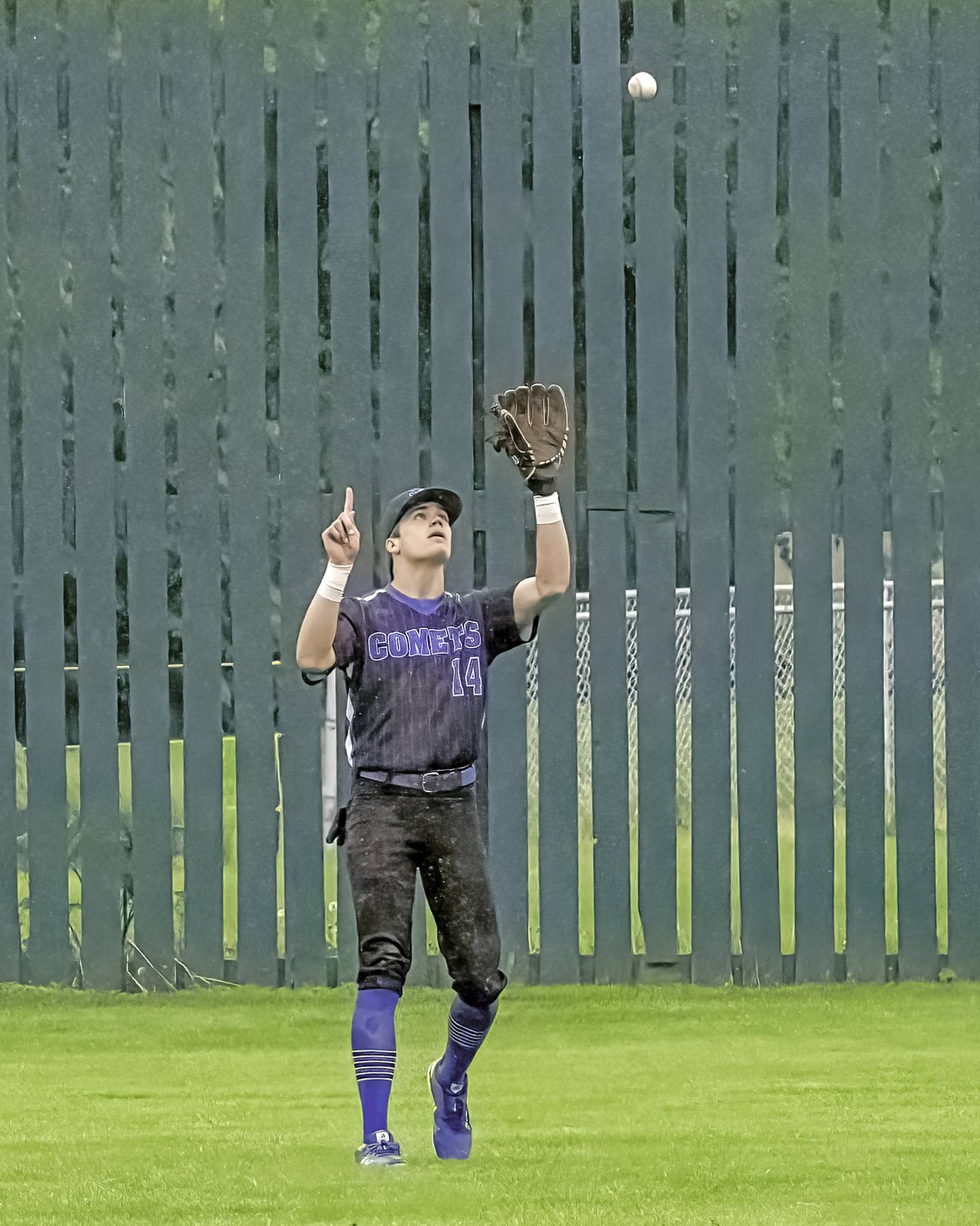 Newman's Kory Mullen signals as he catches a fly ball Saturday against Forreston in the 1A Newman Regional final.