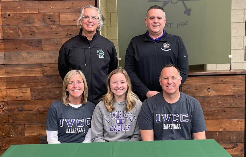 St. Bede senior Leah Smudzinski (seated, center) recently signed to play basketball at IVCC. She was joined at her signing by her parents (seated) Michelle and Mike Smudzinski and (standing left to right) St. Bede coach Tom Ptak and IVCC coach Josh Nauman. Smudzinski averaged 8.8 points, 6.9 rebounds and 2.1 assists per game and was Second-Team All-Three Rivers Conference East Division as a senior.