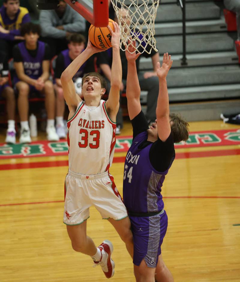 L-P's Gavin Stokes eyes the hoop over Dixon's Jakob Nicklaus on Tuesday, Jan. 20, 2026 in Sellett Gymnasium at L-P High School.