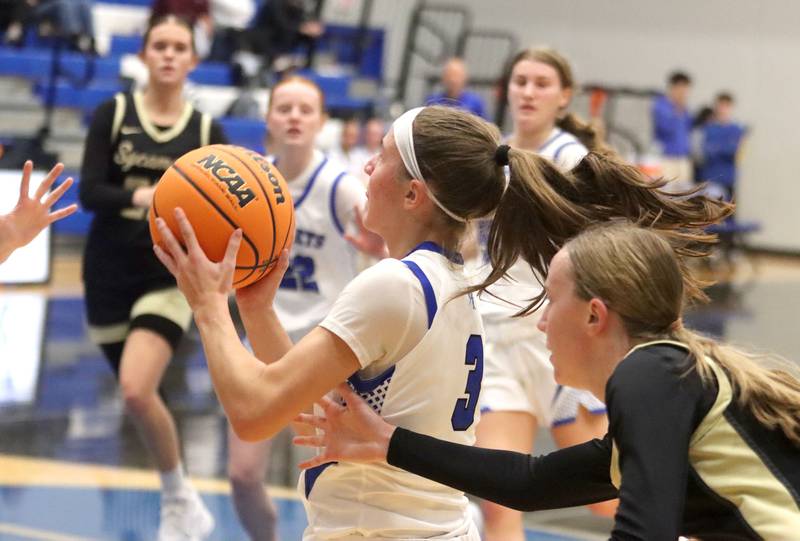 Burlington Central’s Julia Scheuer goes to the hoop against Sycamore in girls basketball at Burlington Central High School in Burlington on Tuesday, November 18, 2025.