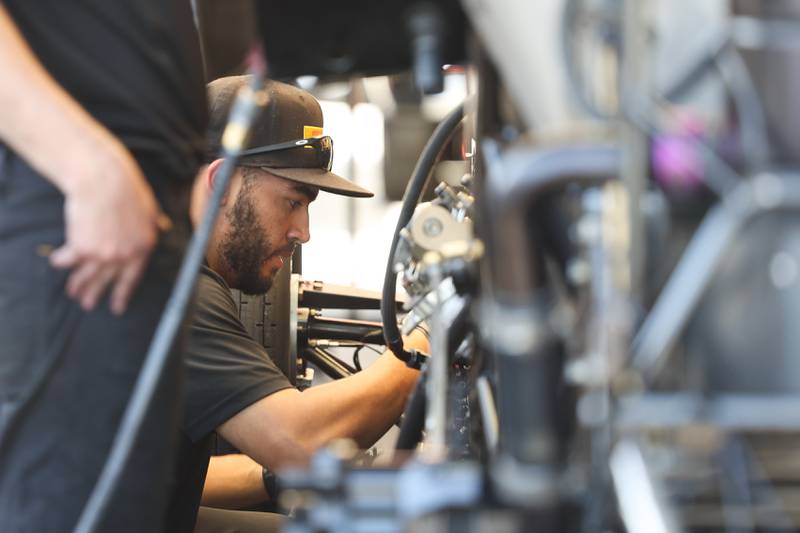 A crew member works on JR Todd’s car before the Funny Car quarterfinal race at the NHRA’s Gerber Collision and Glass Route 66 Nationals at Route 66 Raceway on Sunday, May 19, 2024 in Joliet.