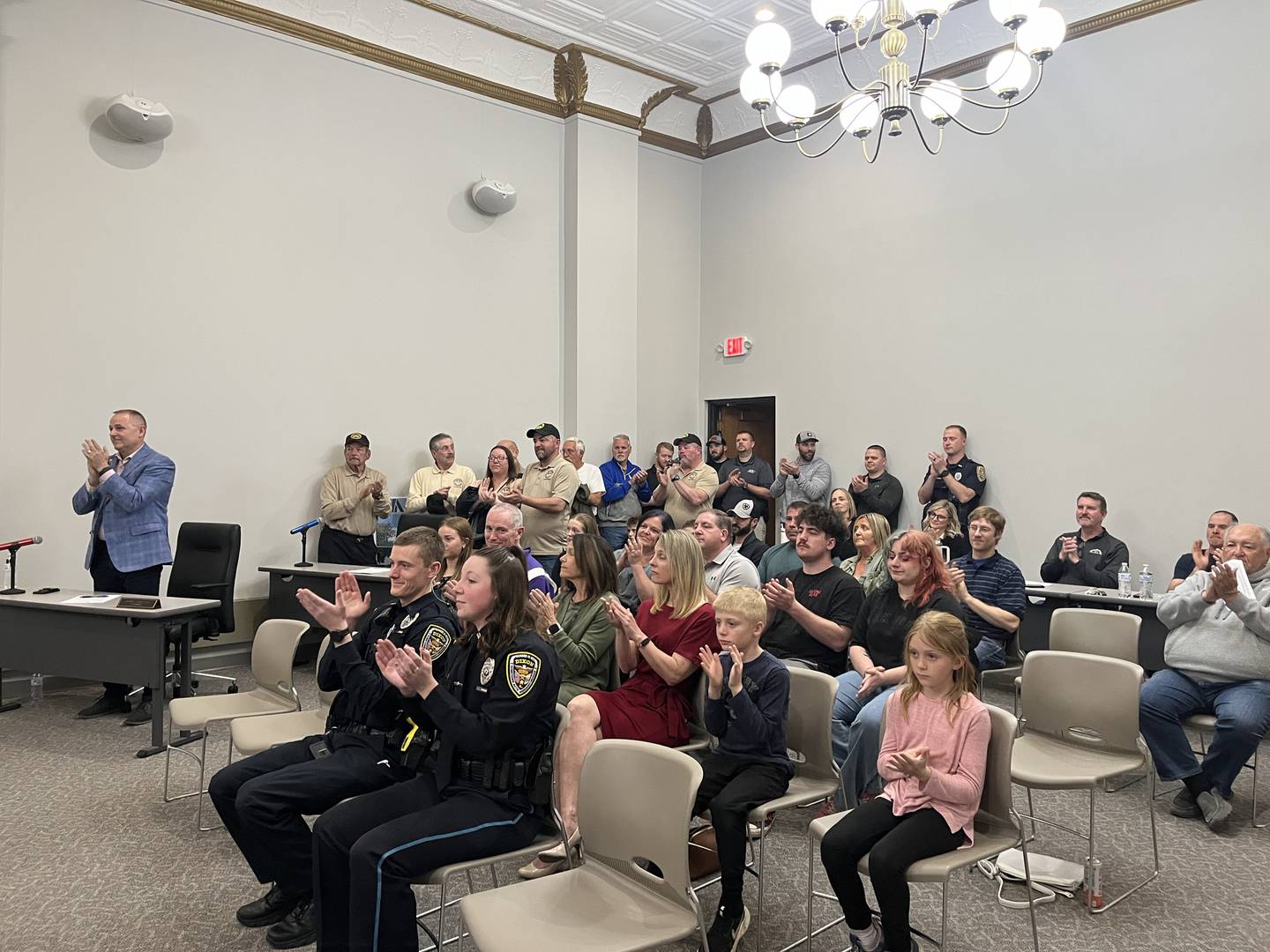 Community members clap after Dixon Deputy Police Chief Doug Lehman is sworn in as interim chief at the Dixon City Council meeting Monday, May 5, 2025.