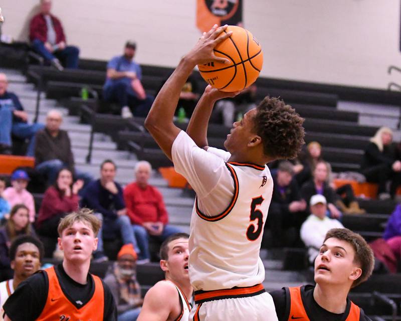 DeKalb's Bryan Miller (5) makes a basket during the third place Dayton Tournament while taking on United Township on Tuesday Dec. 30, 2025, held at DeKalb High School.
