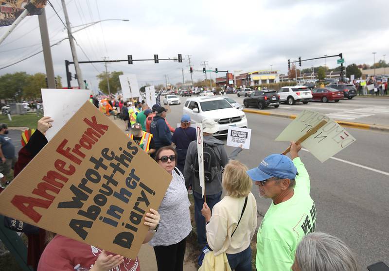 Protesters line Route 31 during a "No Kings” protest rally on Saturday, Oct. 18, 2025, in McHenry. The protest drew thousands of protesters to the area to protest the policies of President Donald Trump.