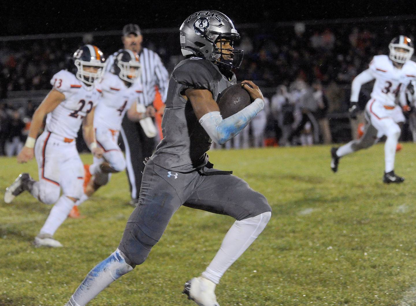 Oswego East quarterback Robert Tyre Jones III (9) breaks into the open field ahead of the Oswego defense to score his second touchdown during a varsity football game at Oswego East High School on Friday, Oct. 14, 2022.