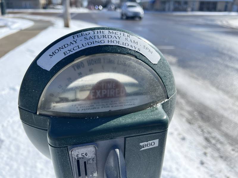 The parking meters in downtown Sycamore accept the three smallest coins in circulation. On Feb 13, a parking meter on West Elm Street went unused after the city received about two inches of snowfall the night before.