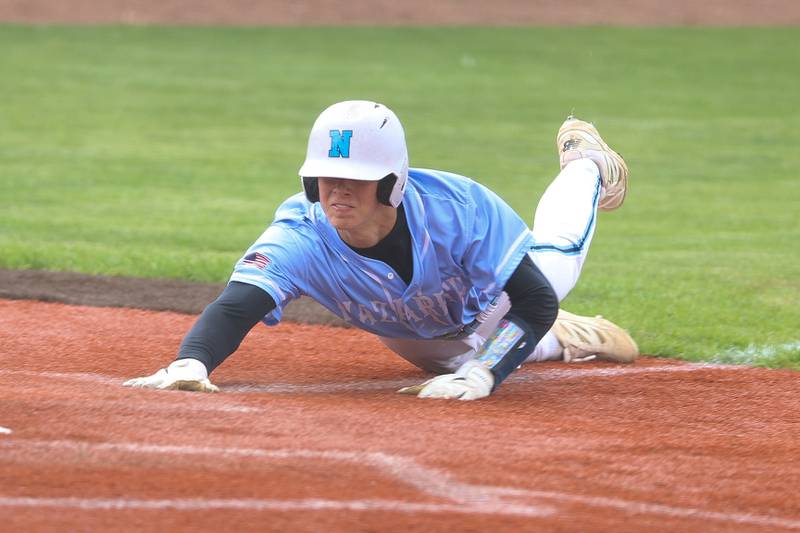 Nazareth’s Bobby Labuda beats the throw to home against Joliet Catholic on Wednesday, April 29, 2026 in Joliet.