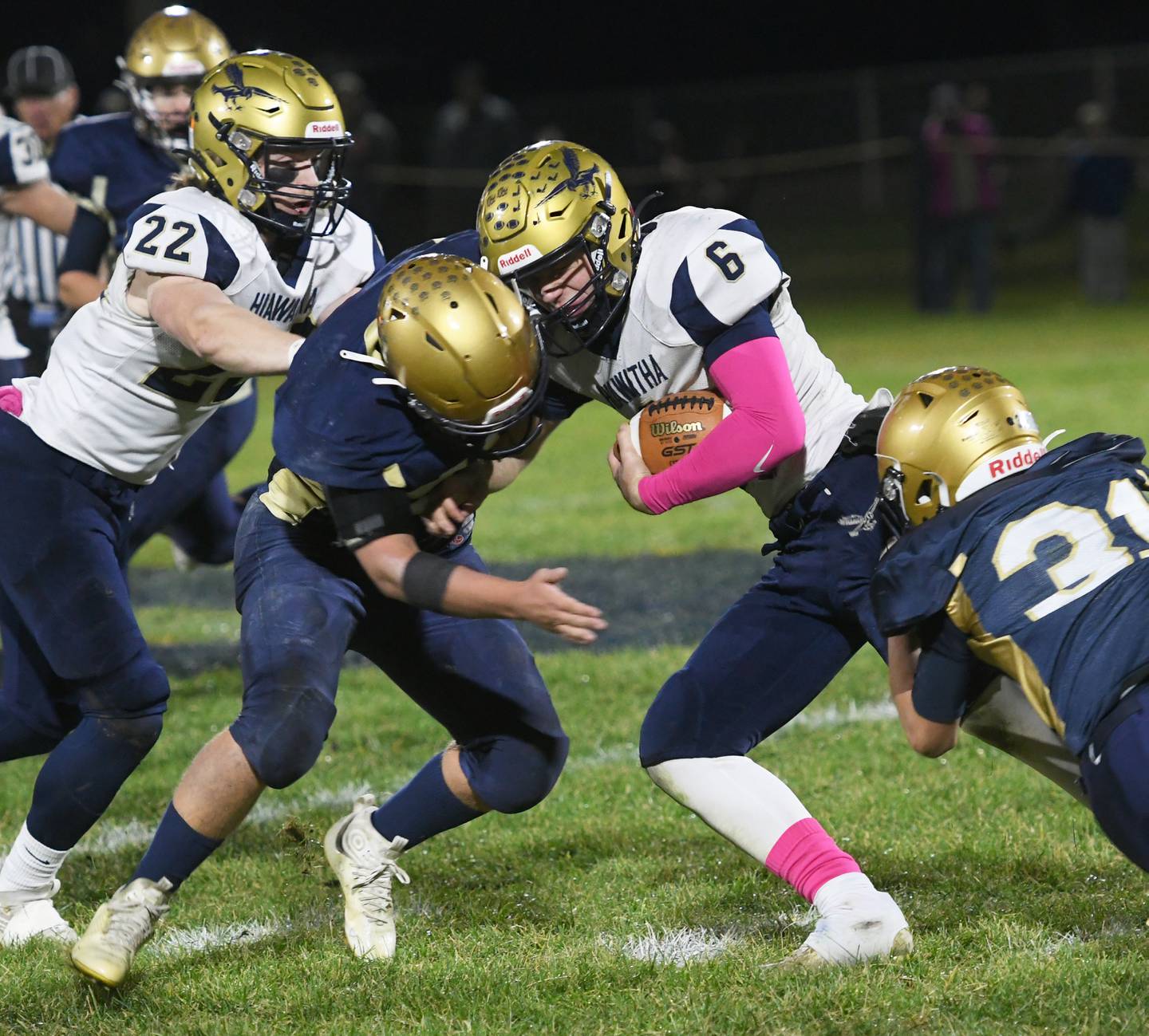 Hiawatha's Christopher Korb tries to escape Polo's Brock Soltow (17) and Noah Dewey (31) during 8-man playoff action on Friday, Oct. 28.