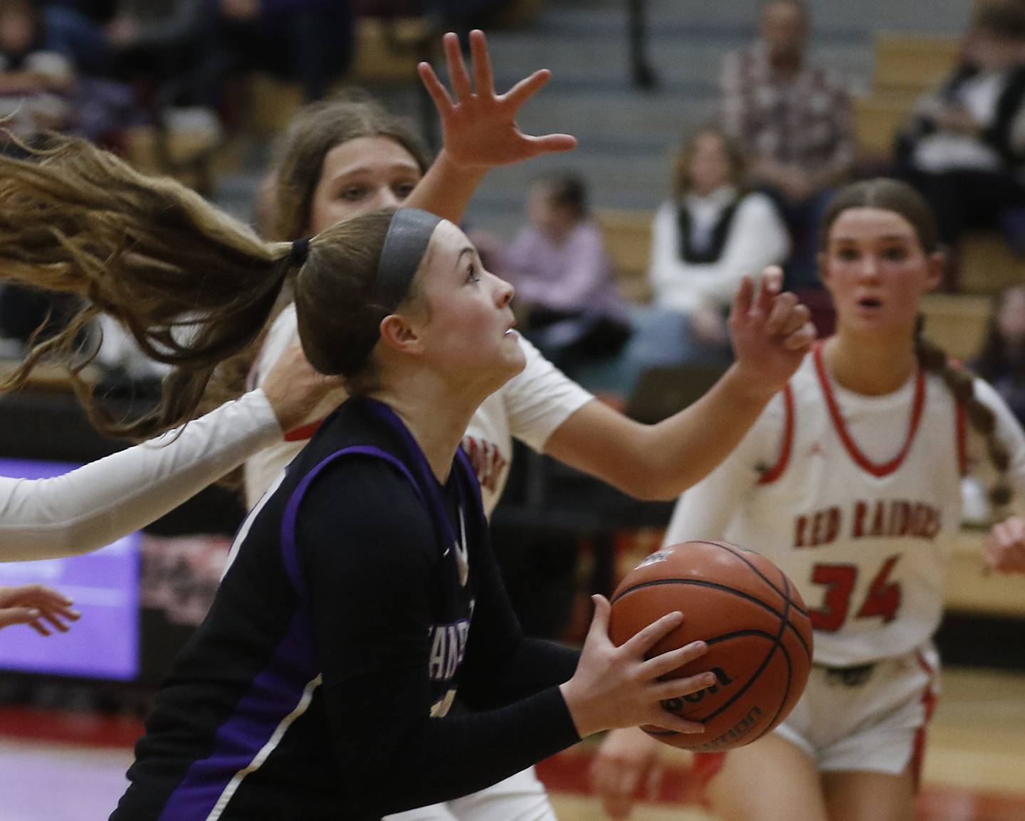 Hampshire's Chloe VanHor shoots the ball as she is defended by Huntley's Paula Strzelecki during a Fox Valley Conference girls basketball game Wednesday, Jan. 24, 2024, at Huntley High School.