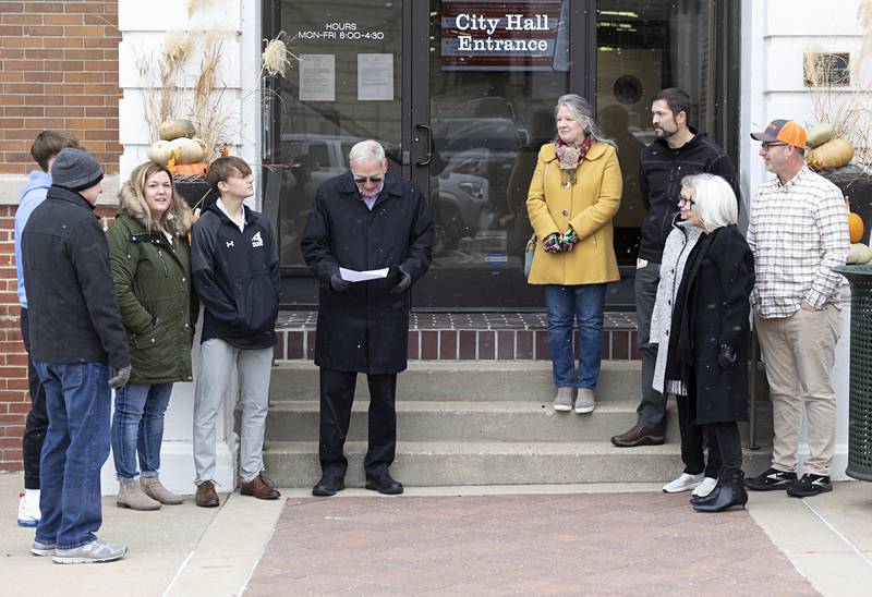 Surrounded by friends, family and supporters, Glen Hughes announces his candidacy for Dixon mayor Friday Nov. 18, 2022 on the steps of city hall.