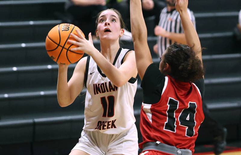 Indian Creek's Ally Keilman looks to score over over Aurora Christian’s Jada Yizkaya during their game Monday, Nov. 25, 2024, at Indian Creek High School in Shabbona.
