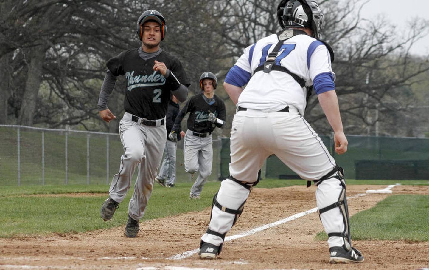 Woodstock North's Jesse Cordoba, left,  prepares to touch home plate as teammate Nate Harris follows close behind during a baseball game against Woodstock Saturday, April 30, 2016 at Emricson Park in Woodstock. Woodstock North defeated Woodstock 15-7.