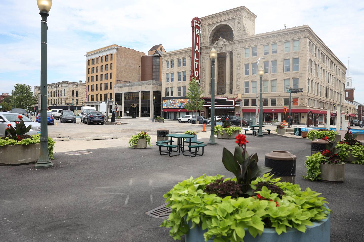 Planters line the businesses along North Chicago Street in downtown Joliet on Monday July 8, 2024.