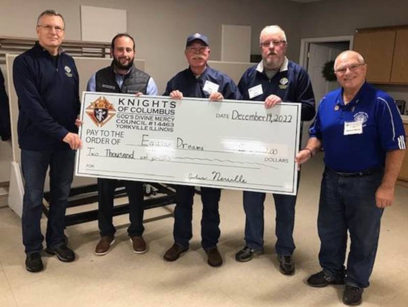 Pictured from left are ID Drive Chairman Michael Gach, Equine Dreams President and CEO Rick Mason, Grand Knight John Neville, Deputy Grand Knight Jim Zbella and Financial Secretary Dan Wiest.