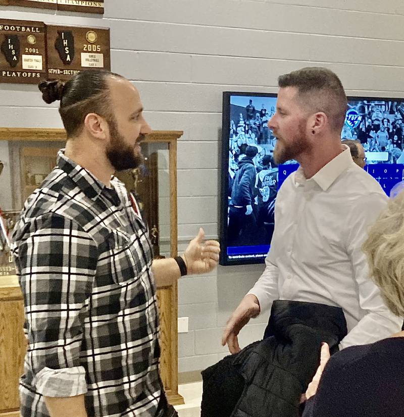 Mike Behrens (left) and Reuben Slock, teammates on Bureau Valley's third-place state basketball teams in 1999-2000 and 2000-01, visit Friday night before the Hall of Fame Night.