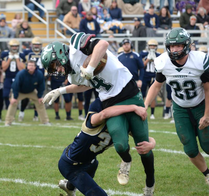 Polo's Elias Perez (32) tackles West Carroll's Raef Pickard-Schintgen (4) during 8-man football playoff action on Saturday, Nov. 9, 2024 at Polo High School.
