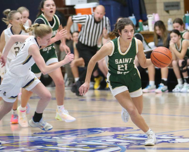 St. Bede's Lily Bosnish steals the ball from Marquette's Lilly Craig to force a break away on Monday, Nov. 27, 2023 in Bader Gym at Marquette High School.
