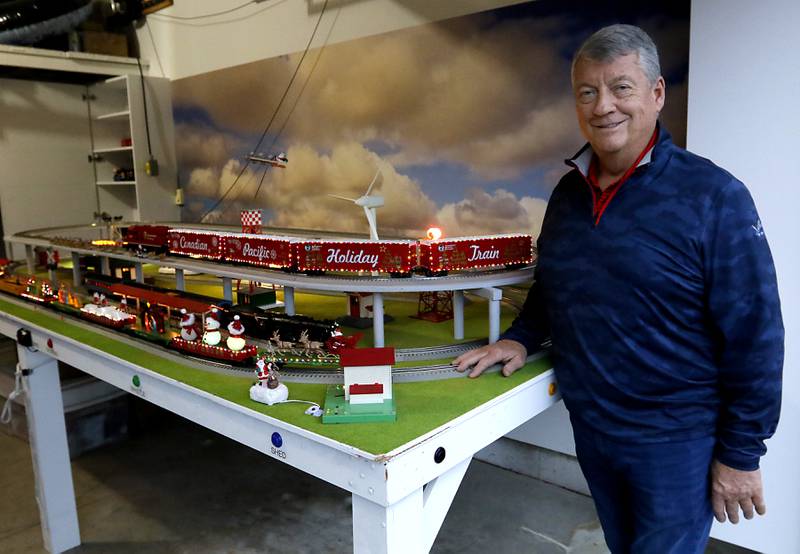 John Smith, president of the McHenry Riverwalk Foundation, with his holiday-themed trains on Thursday, Dec. 19, 2024, at his home in McHenry. He has been opening up his garage along the riverwalk during the weekends for people to see the trains.