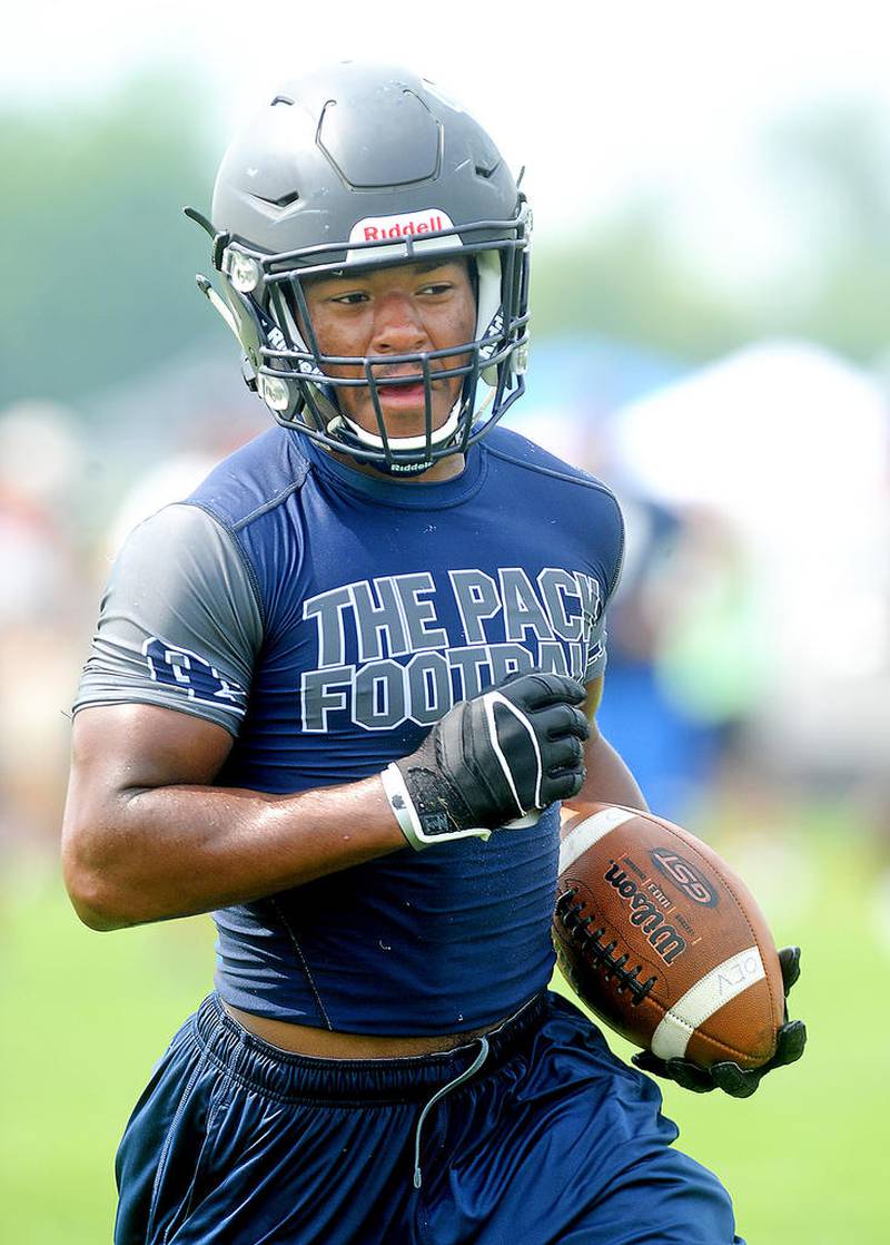 Transfer student and Oswego East running back Ivory Kelly-Martin trots into the endzone after catching a pass during 7 on 7 football scrimmages at Oswego East High School on Thursday, June 21, 2016. Steven Buyansky for Shaw Media